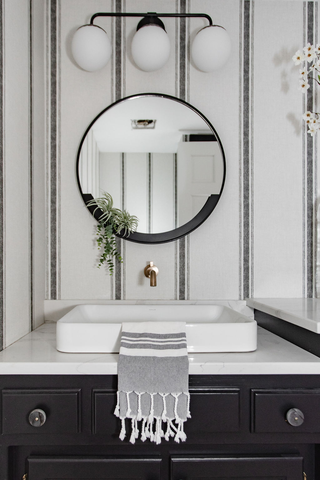 A bathroom renovation's modern take on classic black & white design